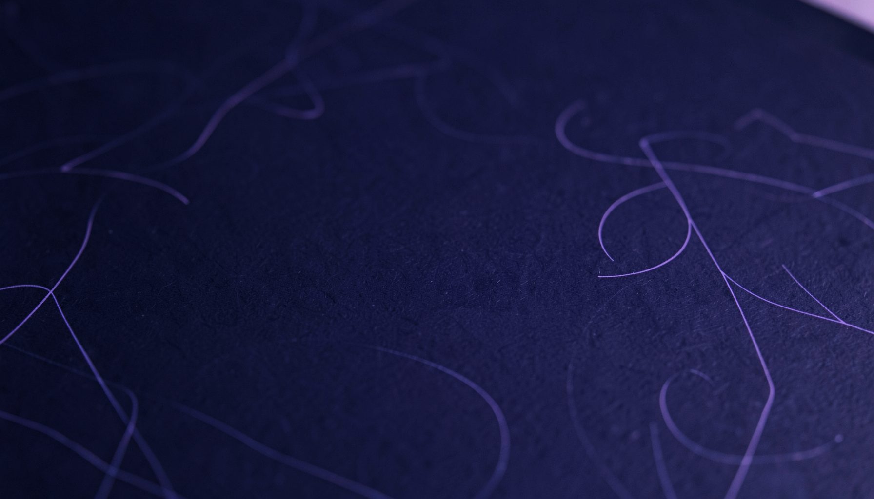 Dark navy card surface with soft violet glow and minimal abstract line patterns, conveying a supportive learning environment